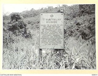 NADZAB- LAE, NEW GUINEA, 1954-08. A PLAQUE ERECTED ON THE TRACK BETWEEN NADZAB AND LAE BY THE AUSTRALIAN BATTLEFIELDS MEMORIAL COMMITTEE UNDER A SCHEME INITIATED BY THE AUSTRALIAN MILITARY FORCES ..