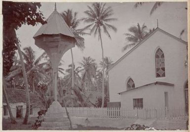 Church entrance and houses. From the album: Cook Islands