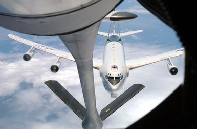 Over the South Pacific a US Air Force (USAF) Airborne Warning and Control System (AWACS) aircraft, 941st AWACS prepares to make contact with a USAF KC-135 Stratotanker, 909th Air Refueling Squadron (ARS), Kadena Air Base (AB), Okinawa. The aircraft are participating in the joint Exercise TANDEM THRUST 03, a joint exercise conducted in the Marianas Islands to include Guam and Tinian. The exercise is a joint endeavor to include forces from the US, Canada, and Australia