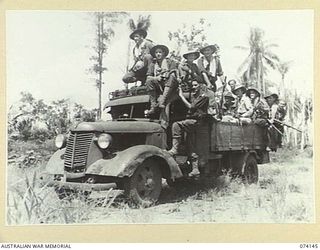 HANSA BAY, NEW GUINEA. 1944-06-20. TROOPS OF THE 4TH INFANTRY BATTALION MAKE GOOD USE OF A CAPTURED JAPANESE ARMY TRUCK AS THEY MOVE INTO THEIR NEW FORWARD POSITIONS