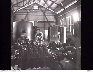 BOMANA, NEW GUINEA. 1943-11-08. A CLOSE-UP OF TWO OF THE MULTI STAGE CENTRIFUGAL PUMPS IN THE BOMANA PUMPING STATION. THIS EQUIPMENT PUMPS THE WATER FROM THE LALOKI RIVER TO PORT MORESBY AT THE ..