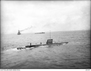 H.M.A. SUBMARINE AE1, WITH HMAS AUSTRALIA AND HMAS YARRA AT A RENDEZVOUS OFF ROSSEL ISLAND IN 1914-09, TAKEN FROM THE BRIDGE OF HMAS ENCOUNTER. (THE AE1 WAS LOST WITH ALL HANDS OFF DUKE OF YORK ..