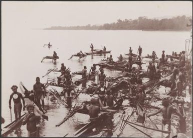 Solomon Islanders in canoes trading with Southern Cross passengers, Santa Cruz Islands, 1906 / J.W. Beattie