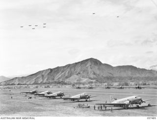 NADZAB, NEW GUINEA. 1943-09-20. TRANSPORT AIRCRAFT JUST TAKING OFF FROM NO. 1 AIRSTRIP