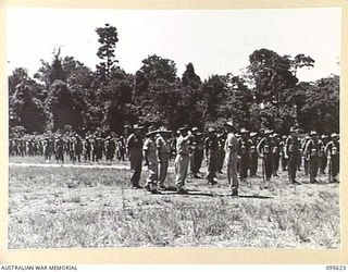 LAE AREA, NEW GUINEA. 1945-09-01. COLONEL J.T. SIMPSON, DEPUTY DIRECTOR OF ORDNANCE SERVICE INSPECTED A PARADE OF THE ORDNANCE PERSONNEL UNDER HIS COMMAND IN THE LAE AREA, AT 4 ADVANCED ORDNANCE ..