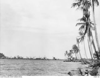 SALAMAUA, NEW GUINEA, 1943-09-26. LOOKING BACK TOWARDS THE TOWN FROM KELA ROAD AFTER THE HEAVY BOMBING BY THE ALLIED AIR FORCE