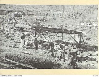 1943-09-22. NEW GUINEA. AUSTRALIAN TROOPS CAPTURE LAE. A GENERAL VIEW OF BOMB BLASTED LAE