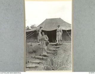 1943-06-10. NEW GUINEA. AT AN AUSTRALIAN GENERAL HOSPITAL IN NEW GUINEA. LEFT TO RIGHT SISTERS E. FOLDER OF TASMANIA AND E. BAXTER OF TASMANIA AND N. O'TOOLE OF PERTH. (NEGATIVE BY N. BROWN)