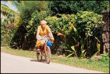 Woman riding a bicycle,Tonga