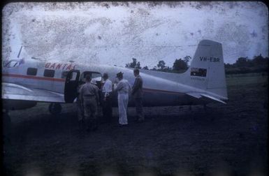 Mr. Paul Hasluck and Colonel Jack Murray beside a Qantas plane at Popondetta, Papua New Guinea, 1951 / Albert Speer