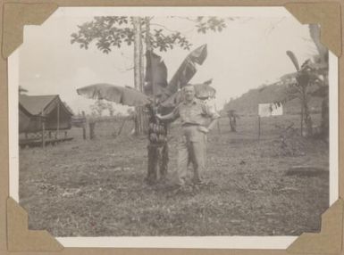 Alfred Amos by a banana palm, Lae, Papua New Guinea, 1945