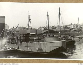 SYDNEY, NSW. 1944-01-22. A GENERAL VIEW OF THE MV "FRANCES PEAT" WHICH IS IN THE PROCESS OF BEING ARMED BEFORE BEING PUT INTO SERVICE WITH THE AUSTRALIAN SMALL SHIPS SECTION IN NEW GUINEA WATERS