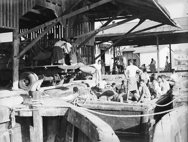 [Polynesian workers on the docks]