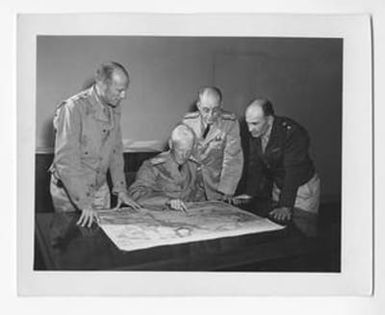 [Admiral Chester W. Nimitz and Others Looking Over a Map]