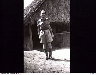 NEW GUINEA. 1943-10. TX1716 SERGEANT F. R. MUSSON OUTSIDE THE AUSTRALIAN MILITARY HISTORY SUBSECTION OFFICE, HEADQUARTERS, NEW GUINEA FORCE