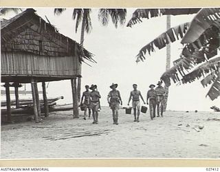 WANIGELA, NEW GUINEA. 1942-10. ARE IN SHORE DEFENDING POSITION IN THE COLLINGWOOD BAY AREA, COMING THROUGH THE NATIVE VILLAGE