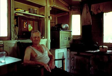 Shorty Sutherland, also known as Short-Arse Shorty from the Shotover.  The old gold-miner lives in a train carriage in the Lowburn Camping Ground.  A few days after this he was off on a Pacific cruise.