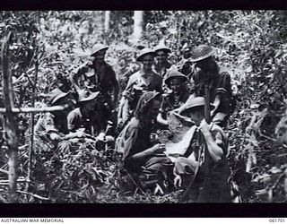 WAREO, NEW GUINEA. 1943-12-09. VX7410 LIEUTENANT (LT) D. C. LAWRIE DCM OF C COMPANY, AND OF CAMBERWELL, VIC, WHO WON HIS DECORATION AT LAE AND WAS TWICE MENTIONED IN DESPATCHES, AUTOGRAPHS A ..