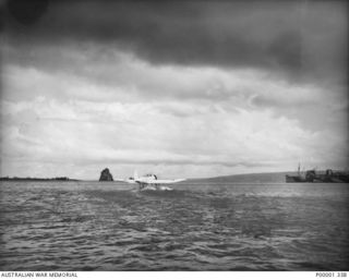 NEW BRITAIN, 1945. JAPANESE AICHI E13A1 "JAKE" SEAPLANE IN SURRENDER MARKINGS OF WHITE WITH GREEN CROSSES. ON 1945-10-14 THIS AIRCRAFT WAS FLOWN INTO JACQUINOT BAY AND SURRENDERED TO RNZAF FORCES. ..