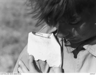 FORBES, AUSTRALIA. 1943-02. CLOSE-UP OF A DETECTOR WORN ON THE SHOULDER OF A "GUINEA PIG" IN A GAS SHELL EXPERIMENT. STAINS ARE OF APPROXIMATE DIAMETER OF 0.75 MM CORRESPONDING TO DROPS OF DIAMETER ..