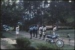 Police and other government employees in uniform lined up in front of patrol officer, Tabibuga