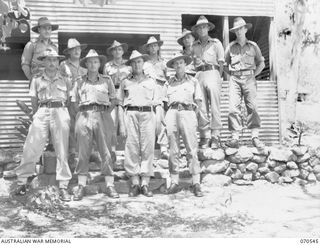 PORT MORESBY, PAPUA, 1944-02-20. A GROUP OF OFFICERS OF THE 5TH AUSTRALIAN CHIEF ENGINEER (WORKS), ROYAL AUSTRALIAN ENGINEERS (A.I.F.), PICTURED OUTSIDE THEIR HEADQUARTERS. IDENTIFIED PERSONNEL ..