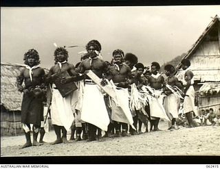 Kila Kila, New Guinea. 1943-12-25. Natives of the Mekeo tribe perform one of their traditional dances during the Christmas celebrations at the Australian and New Guinea Administration Unit (ANGAU) ..