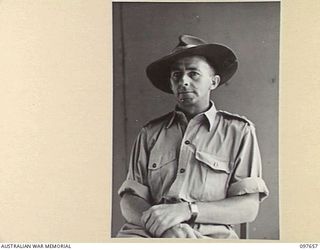 LAE, NEW GUINEA. 1945-10-04. LIEUTENANT COLONEL A.F. KURRIE, ASSISTANT DIRECTOR OF ARMAMENT SURVEY, HEADQUARTERS FIRST ARMY