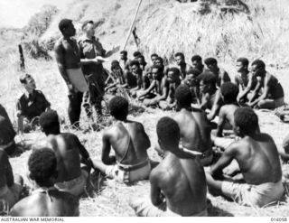 Ramu Valley, New Guinea. October 1943. Divine Service for members of the Papuan Infantry
