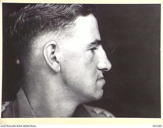 TOROKINA, BOUGAINVILLE, 1945-06-21. TREATMENT OF MALOCCLUSION FOR PATIENT LT R.C. PRICE, AT HQ 4 BASE SUB AREA, BY DENTAL OFFICER, MAJ A.G. ROWELL. PROFILE VIEW SHOWING NEW PU AND PL DENTURES IN ..