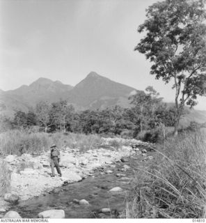 1943-05-07. GOODENOUGH ISLAND. TALL MOUNTAINS AT GOODENOUGH ISLAND, 7000 AND 8500 FEET. (NEGATIVE BY N. BROWN)