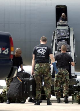 U.S. Air Force Airmen from the 613th Security Forces Squadron, 613th Contingency Response Group, load their cargo and equipment on a KC-135 Stratotanker aircraft at Andersen Air Force Base, Guam before deploying to Thailand in support of tsunami relief operations on Dec. 29, 2004. The Airmen are bound for Southeast Asia as part of a disaster relief operation following a 9.0 magnitude earthquake that struck off the coast of Indonesia causing a tsunami that have affected 12 countries and has killed at least 100,000 people. (USAF PHOTO by STAFF SGT. Bennie J. Davis III) (Released)