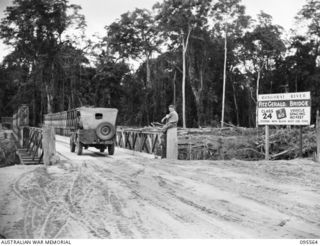 HONGORAI RIVER, BOUGAINVILLE, 1945-08-29. A BAILEY BRIDGE CONSTRUCTED BY 7 FIELD COMPANY ROYAL AUSTRALIAN ENGINEERS ENGINEERS TO REPLACE THE AUSTRALIAN PANEL TYPE WASHED OUT BY RECENT FLOODS