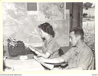LAE, NEW GUINEA, 1945-05-16. PRIVATE H.C. FLEMING, AUSTRALIAN WOMEN'S ARMY SERVICE CLERK (1), AND CORPORAL W.J. EATHER (2), AT WORK IN THE DENTAL UNIT, HEADQUARTERS LAE BASE SUB-AREA. AUSTRALIAN ..