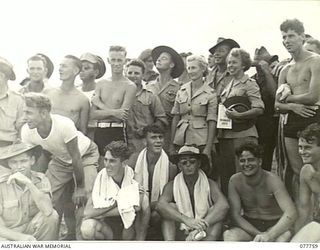 MALAHANG BEACH, LAE, NEW GUINEA. 1944-12-31. A SECTION OF THE LARGE CROWD WATCHING THE CHRISTMAS SURF CARNIVAL ORGANISED BY NX26061. CAPTAIN R.W. DIBBEN, DEPUTY ASSISTANT DIRECTOR OF ORDNANCE ..