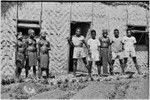 Courtship: decorated adolescent girls and potential male suitors in front of the Cooks' house