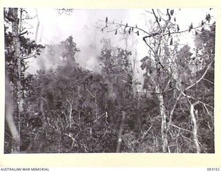 WEWAK AREA, NEW GUINEA, 1945-06-17. A GENERAL VIEW SHOWING THE ARTILLERY BARRAGE ON HILL 2, PRELIMINARY TO THE ATTACK BY B COMPANY, 2/8 INFANTRY BATTALION