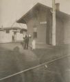 Unidentified Man, Woman, and Dog at North Guam, New Mexico Train Depot, circa 1910s