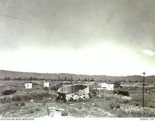 NEW BRITAIN, 1945-09. DAMAGED JAPANESE STORAGE AREA IN THE RABAUL AREA. (RNZAF OFFICIAL PHOTOGRAPH.)