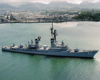 An elevated starboard bow view of the guided missile destroyer USS BENJAMIN STODDERT (DDG 22) leaving port