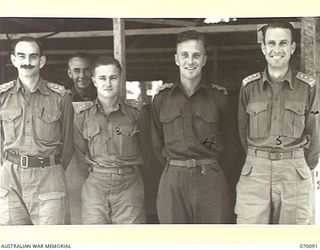 DUMPU, NEW GUINEA. 1944-01-25. OFFICERS OF HEADQUARTERS 7TH DIVISION. IDENTIFIED PERSONNEL ARE: SX11102 CAPTAIN D.F. SAUNDERS, GSO.III (LEARNER) (1); NX325 MAJOR A,S, MACKINNON (LIAISON OFFICER) ..