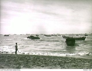 THE SOLOMON ISLANDS, 1945-01-13. LANDING CRAFT APPROACHING A BEACH AT BOUGAINVILLE ISLAND. (RNZAF OFFICIAL PHOTOGRAPH.)