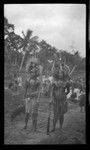 Portrait of two men wearing traditional Samoan clothing and ornaments