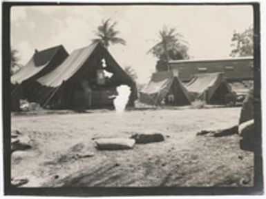 [Post Exchange, barber shop, and gun cleaning tent at military camp, Saipan]