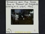 Sharing out the food for a feast at Magarida during HH visit, 1964