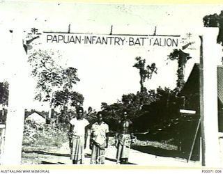 TOROKINA, BOUGAINVILLE ISLAND, SOLOMON ISLANDS, 1945-09. THREE MEMBERS OF THE PAPUAN INFANTRY BATTALION