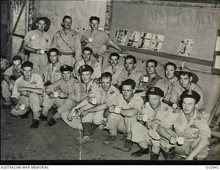 NADZAB, NEW GUINEA. C. 1944-02. GROUP PORTRAIT OF CREWS OF NO. 24 (VULTEE VENGEANCE) SQUADRON RAAF TAKING A CUP OF TEA ON THEIR RETURN FROM A RAID ON HANSA BAY NEAR MADANG. FRONT ROW: FLIGHT ..