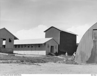 3 MILE, PORT MORESBY, NEW GUINEA. 1943-12-14. REFOLDING SHED (LEFT), INSPECTING SHED (RIGHT) AND THE PARACHUTE DRYING SHED (CENTRE) OF THE 1ST AUSTRALIAN PARACHUTE REFOLDING PLATOON, AUSTRALIAN ..