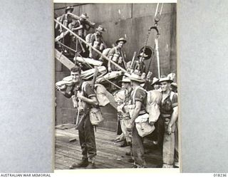 Jacqinot Bay, New Britain: 9 March 1945. Australian troops disembarking from a transport