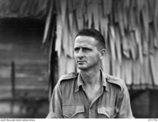 PORT MORESBY, PAPUA, NEW GUINEA, 1944-04-01. SX32614 STAFF SERGEANT A. G. EWENS, AT ALLIED GEOGRAPHICAL SECTION, HEADQUARTERS NEW GUINEA FORCE